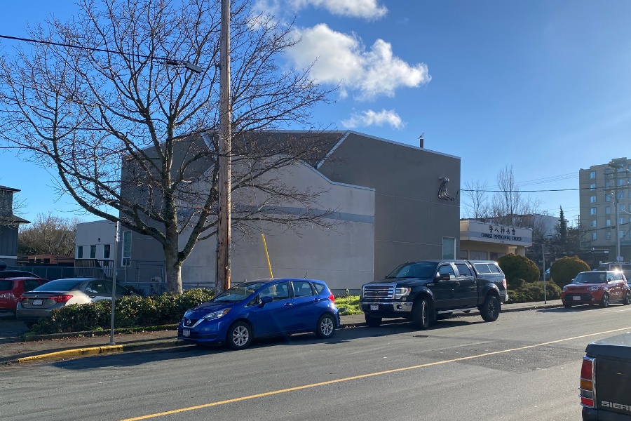 The exterior of Chinese Pentecostal Building, a commercial property, designed by Alan Lowe Architecture with light coloured siding.