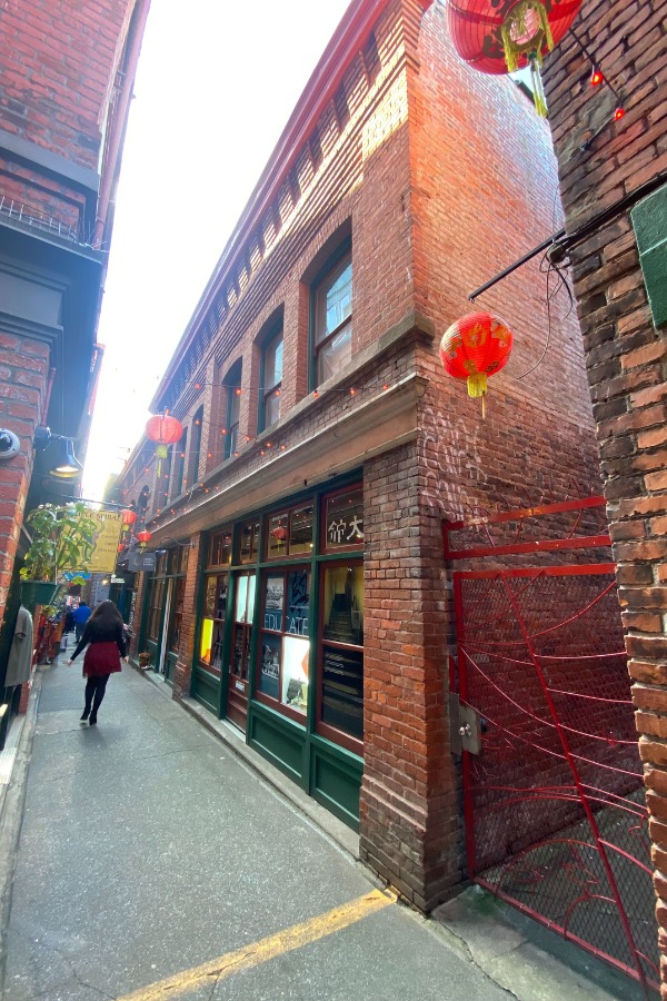 The exterior of Hook Sin Tong Building, a commercial property, designed by Alan Lowe Architecture with red brick exterior siding.