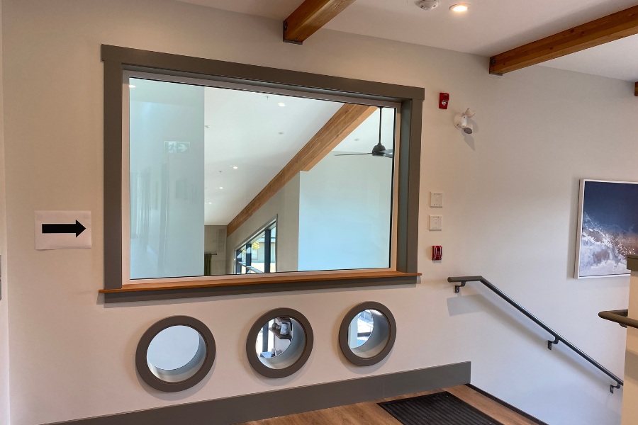 A room mirror leading to the stairs in the Qwalayu House, designed by Alan Lowe Architecture.